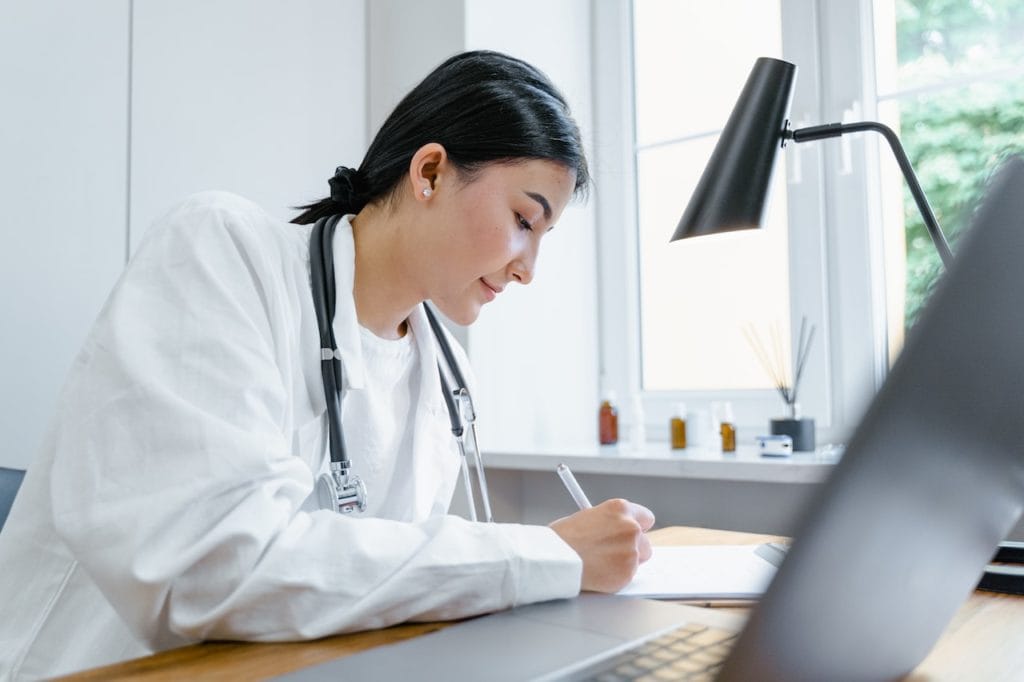 doctor taking notes for Suboxone induction