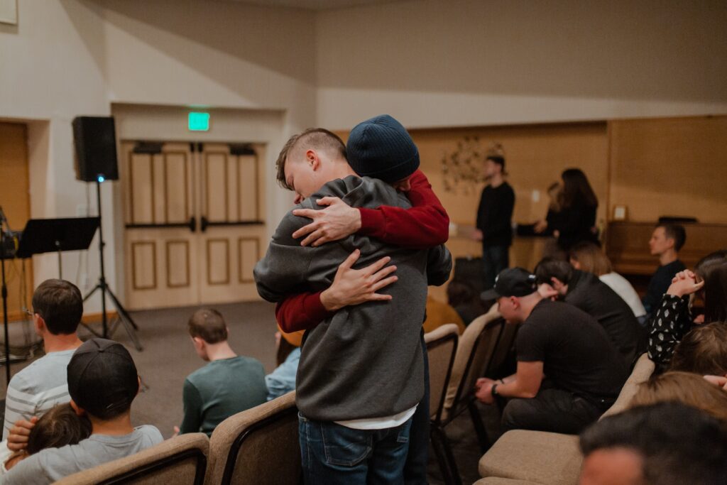 people hugging after discussing long-term effects of fentanyl
